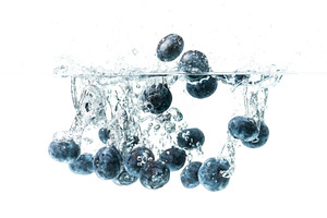 Blueberries sinking underwater, a Food & Drink Photo by MadPhotos