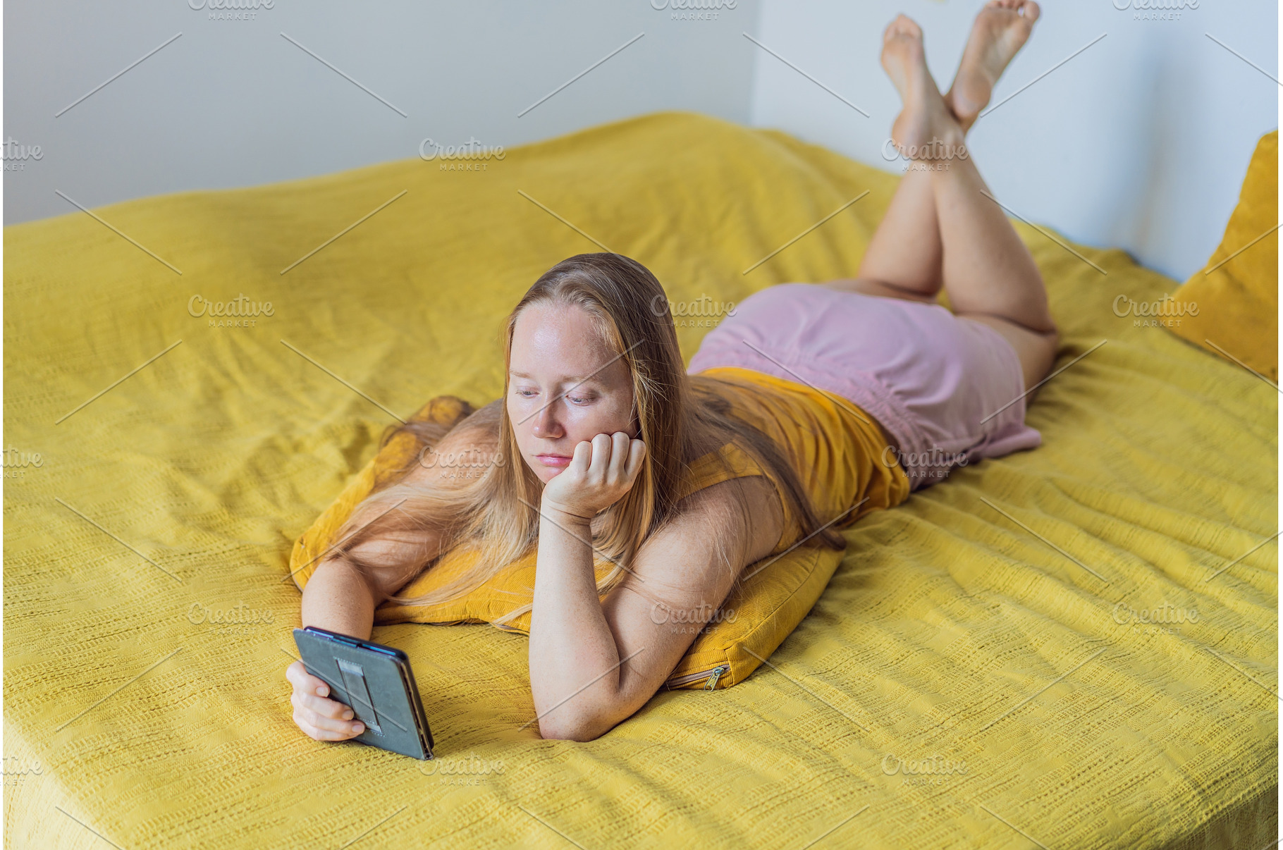 Woman lying in bed and reading an e, a Person Photo by Elizaveta Galitskaya