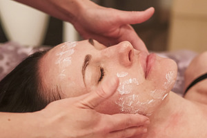Beauty care facial treatment hand cream woman face, a Person Photo by Photo Drive Studio