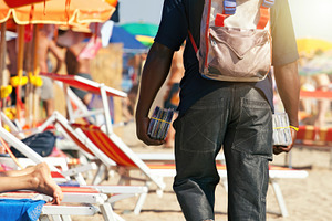 Street vendor selling music and movies on the beach, an Abstract Photo by Antonio Gravante Market