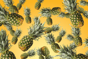 Collage of many whole pineapples flying on a bright orange and y, a Photo by ndanko