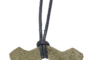 Blank suede tag in grayish green on a black cord with a tip. Iso, a Business Photo by ndanko