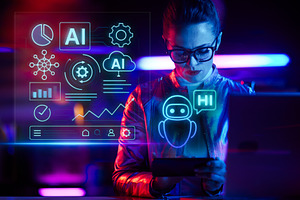 pensive trendy woman in glasses with laptop using smartphone, a Technology Photo by Alliance Images