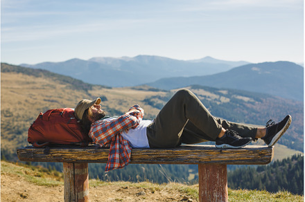 Male Hiker Resting on Top of the