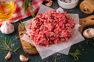 Ground beef, minced meat ready for cooking dinner, a Food & Drink Photo by Rimma