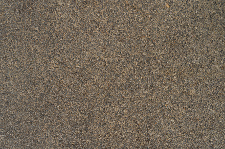 Granite gravel stones flooring pattern surface texture. Close-up, a Background Photo by Tampatra