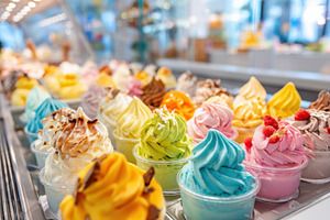 Colorful meringue desserts in cups on a bakery counter, a Food & Drink Photo by AlyaAnd