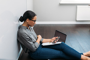 Side view of a young woman counting, a Business Photo by Artem Varnitsin
