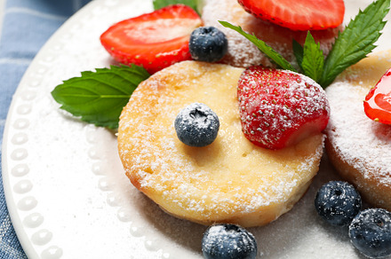 Concept of tasty sweet food, cheese pancakes, close up, a Food & Drink Photo by AtlasStudio