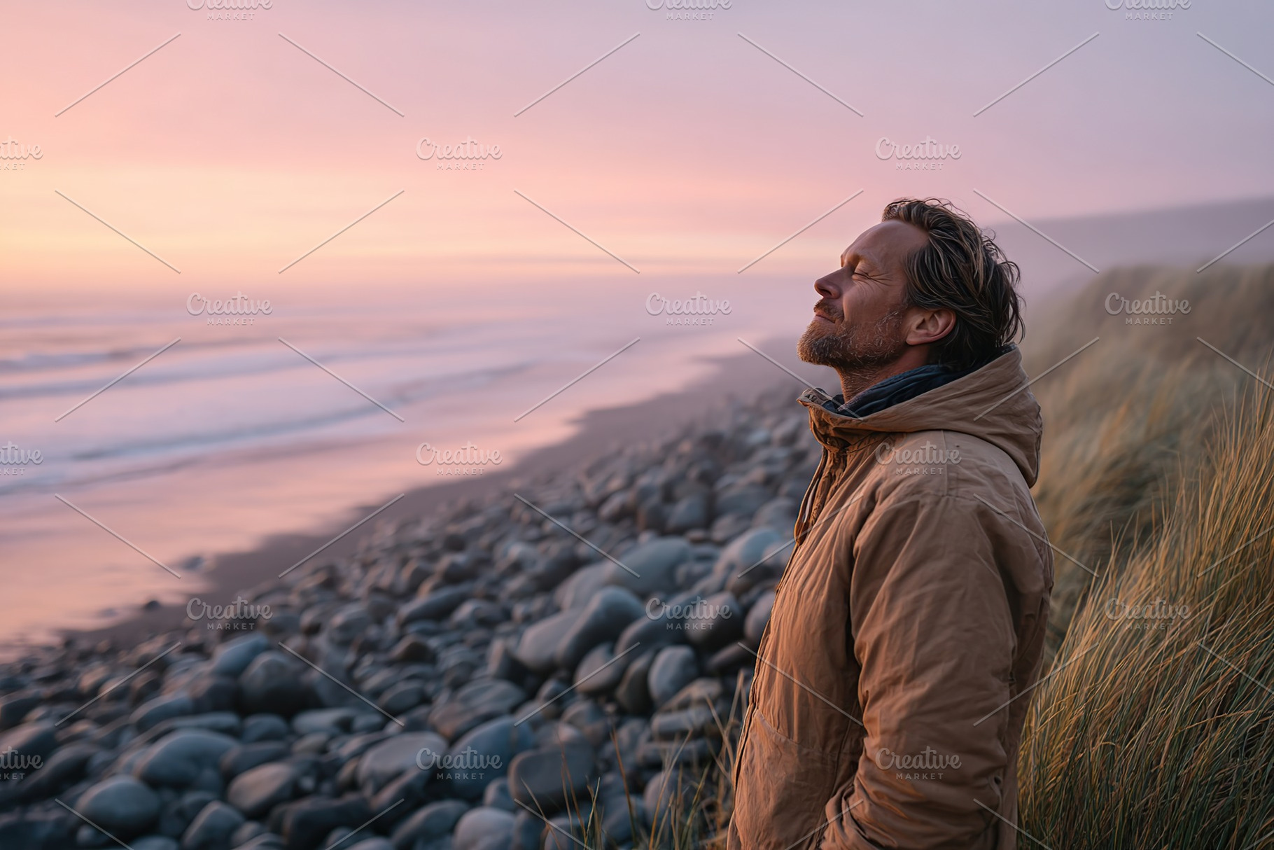 Man enjoying sunset at rocky beach during calm evening by the ocean, a Photo by AlyaAnd