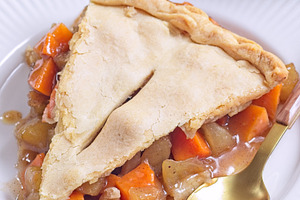 Homemade apple and sweet potato cobbler pie showing filling ingredients, vertic, a Food & Drink Photo by iuliia_n