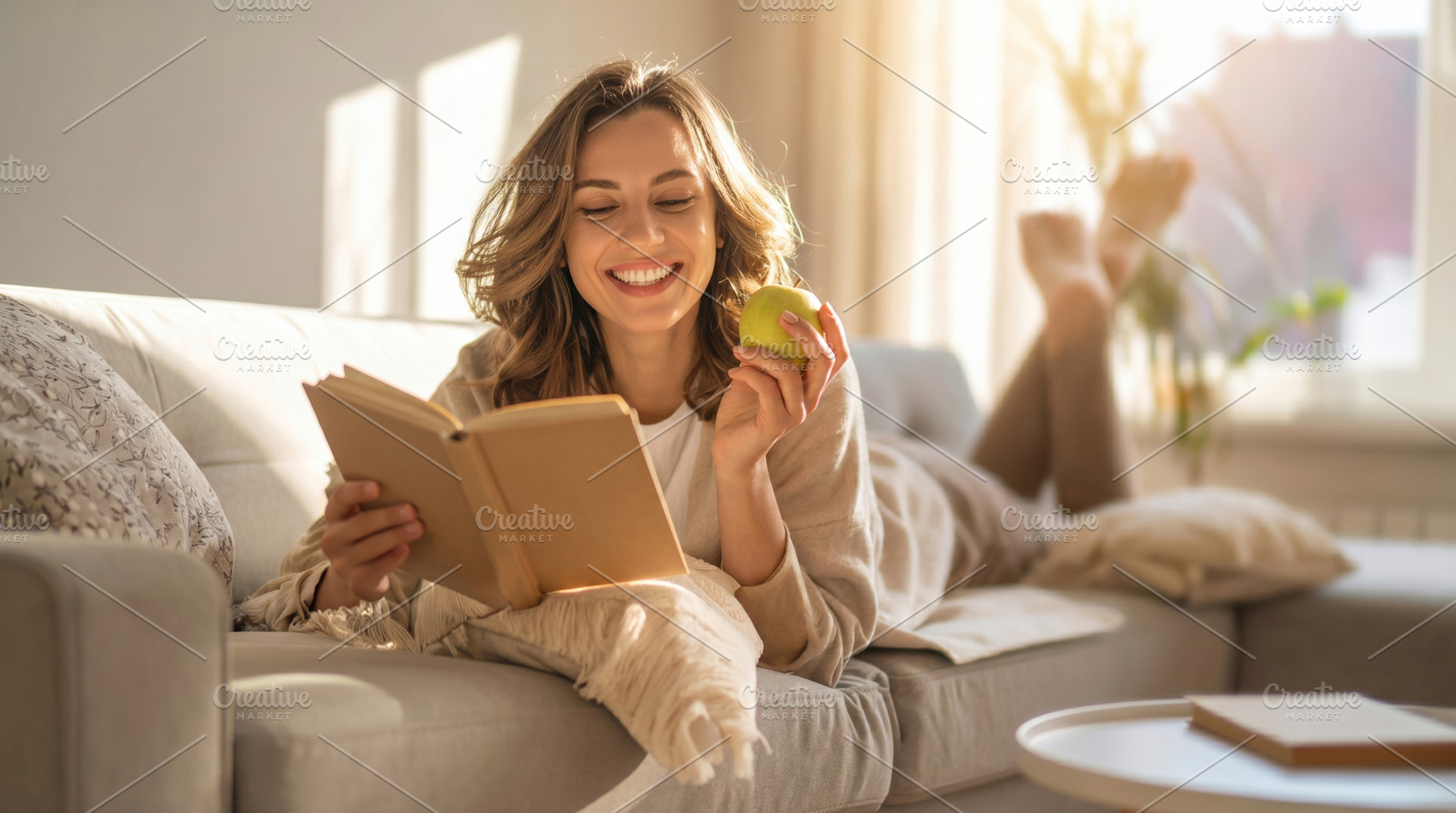 Smiling Woman Reading Book with Green Apple, a Photo by Davizro's Market