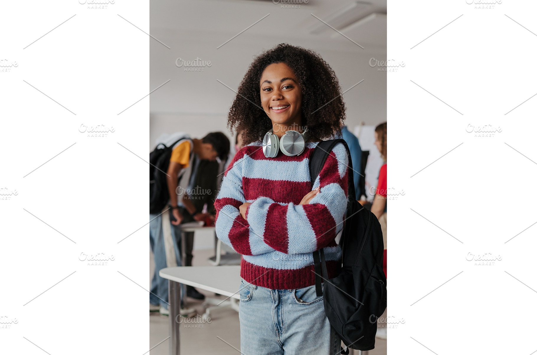 Confident teen student standing in, a School & Education Photo by HalfPoint