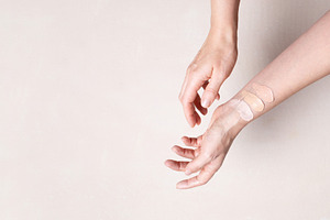 Female hands with makeup foundation