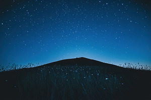 Hill silhouette against a starry nig, a Photo by Iftikhar Alam