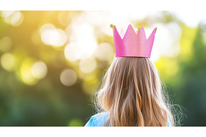 girl wearing pink crown outdoors, a Nature Photo by Lermont51