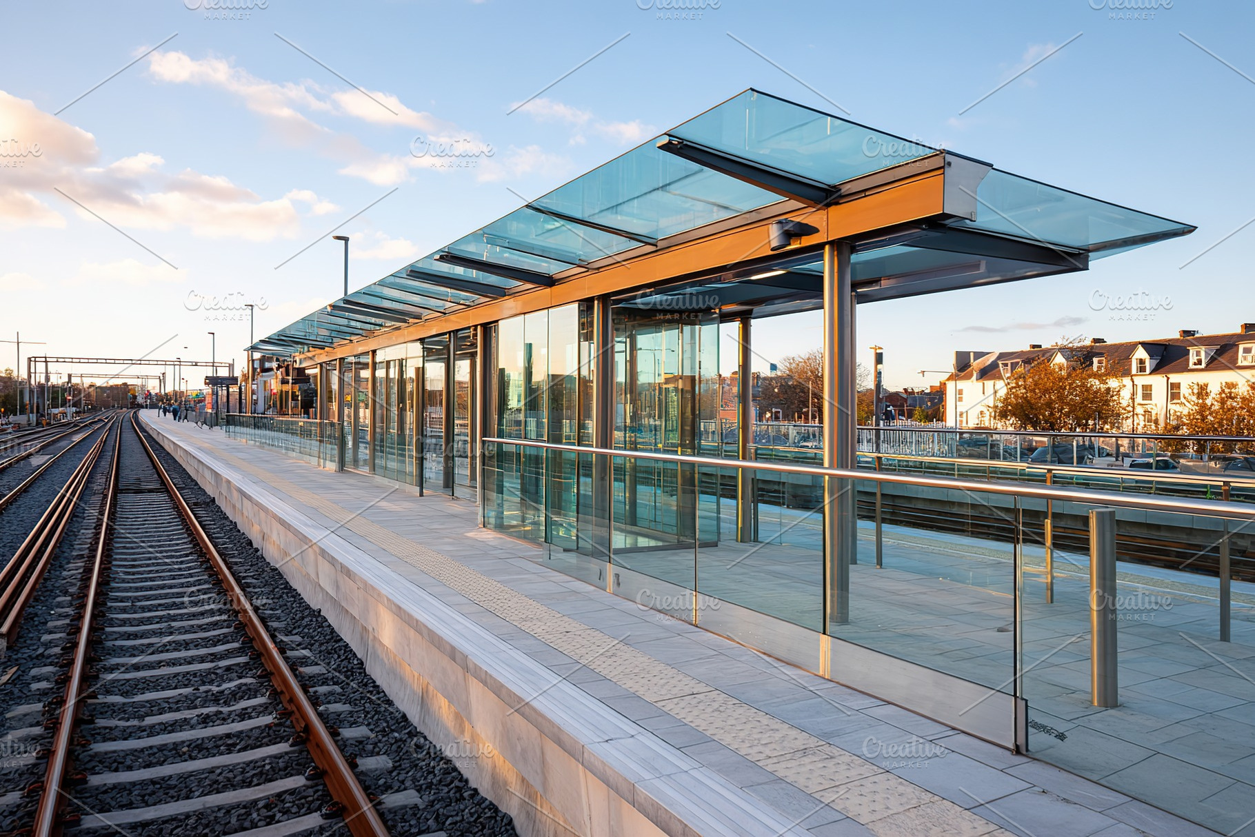 Modern train station platform with glass structure and sunset sky in urban sett, a Transportation Photo by AlyaAnd
