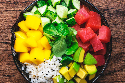 Poke bowl with fresh tuna, avocado, mango, cucumber, lettuce and, a Food & Drink Photo by 5PH