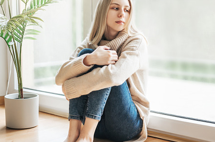 Sad girl near window thinking about something, a Person Photo by Olena Rudo