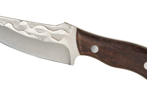 Tactical knife with wooden handle, ring and forged pattern on th, an Industrial Photo by ndanko