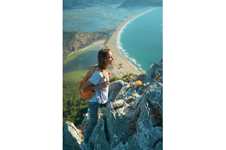 Tourist woman hiking on mountains, a Person Photo by vitaliymateha photography