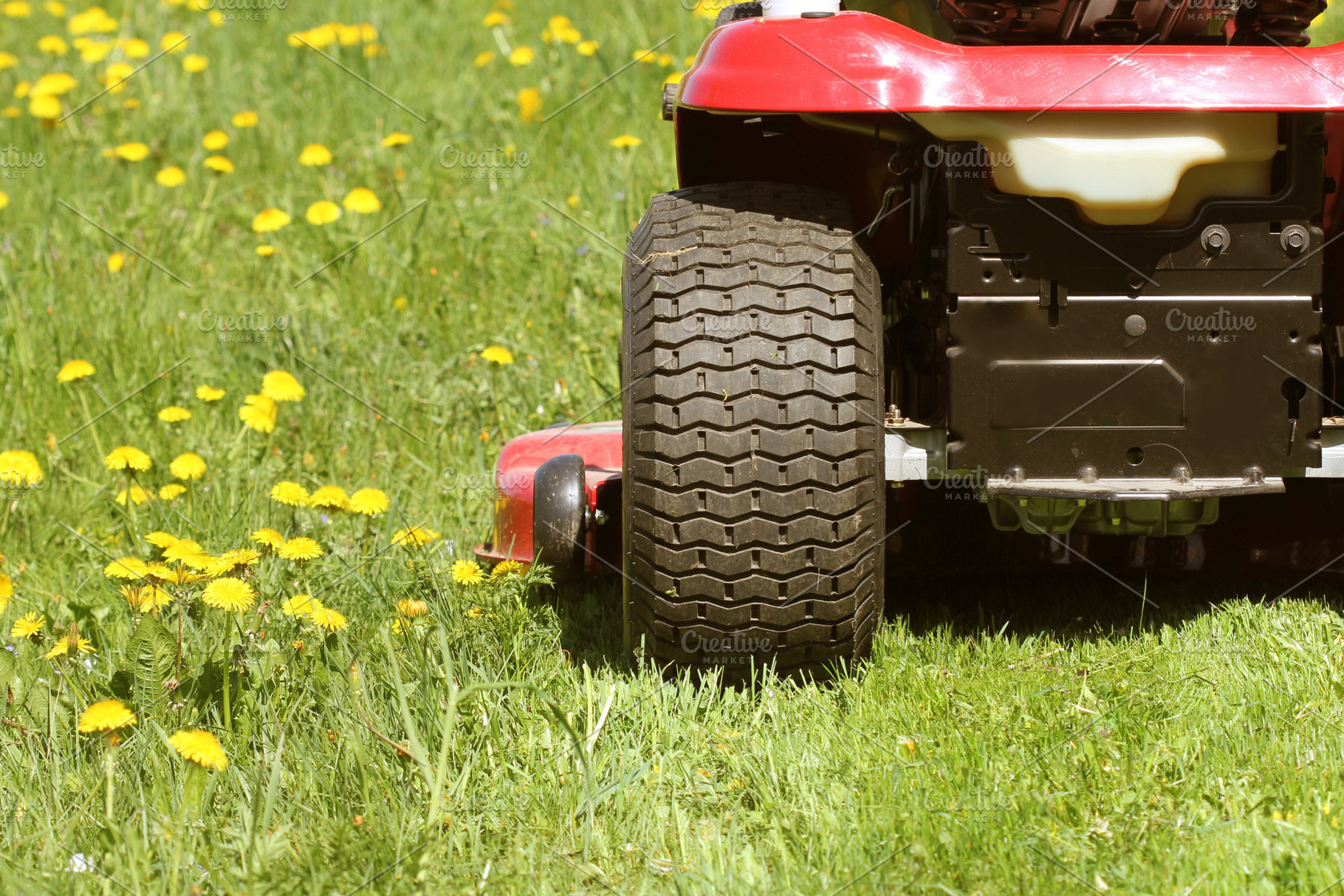 Cutting the grass of on a tractor la featuring lawn, caree, and quipment, an Industrial Photo by Vaivirga