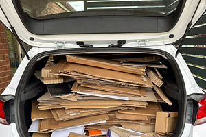 Taking Cardboard To Be Recycled, an Industrial Photo by THP Creative