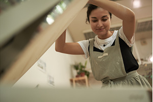 Pottery artist near oven in workshop