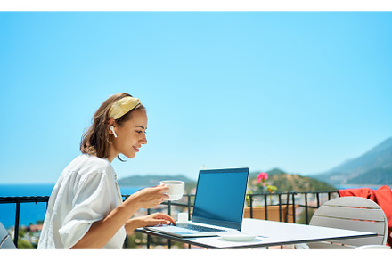 Adult woman using laptop computer, a Person Photo by vitaliymateha photography