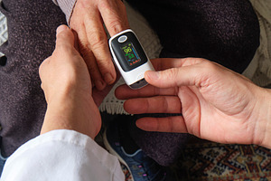 oxygen levels are checked during home care, a Photo by Nito