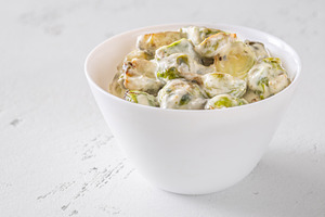 Roasted Brussels sprouts with creamy blue cheese sauce in white, a Food & Drink Photo by Alexander Prokopenko