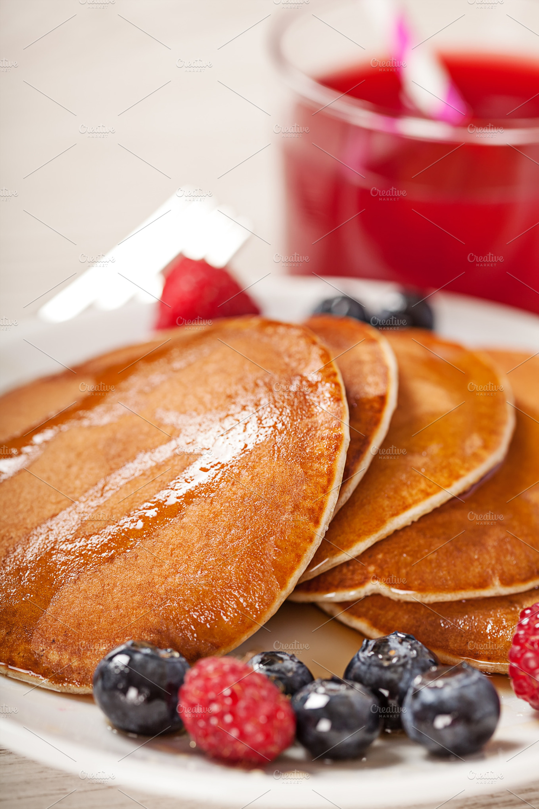 Stack of pancakes with berries breakfast containing background, berry, and