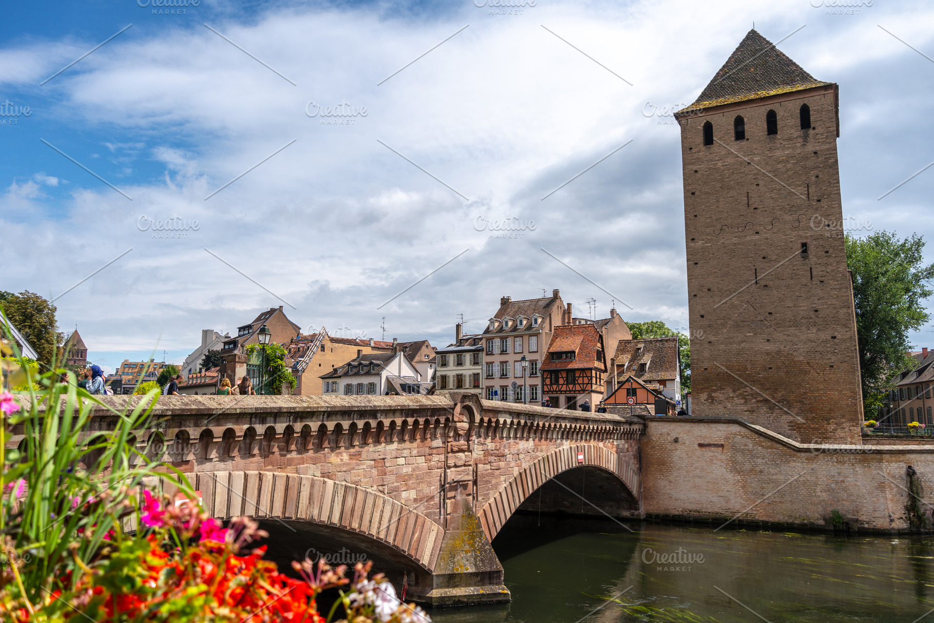 Stone bridge and traditional houses in Strasbourg, France, an Architecture Photo by GoodGoods