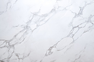 Polished white marble surface with soft gray veining and natural, an Abstract Photo by José Manuel Gelpi