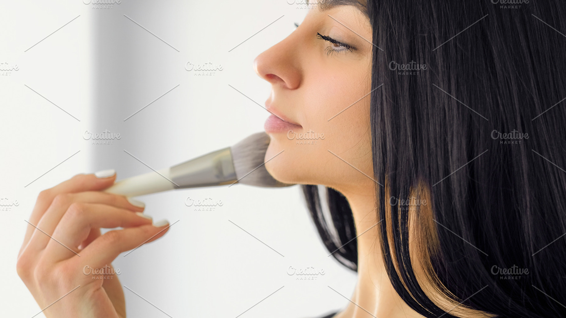 Applying makeup glamour cosmetic woman face brush, a Person Photo by Photo Drive Studio
