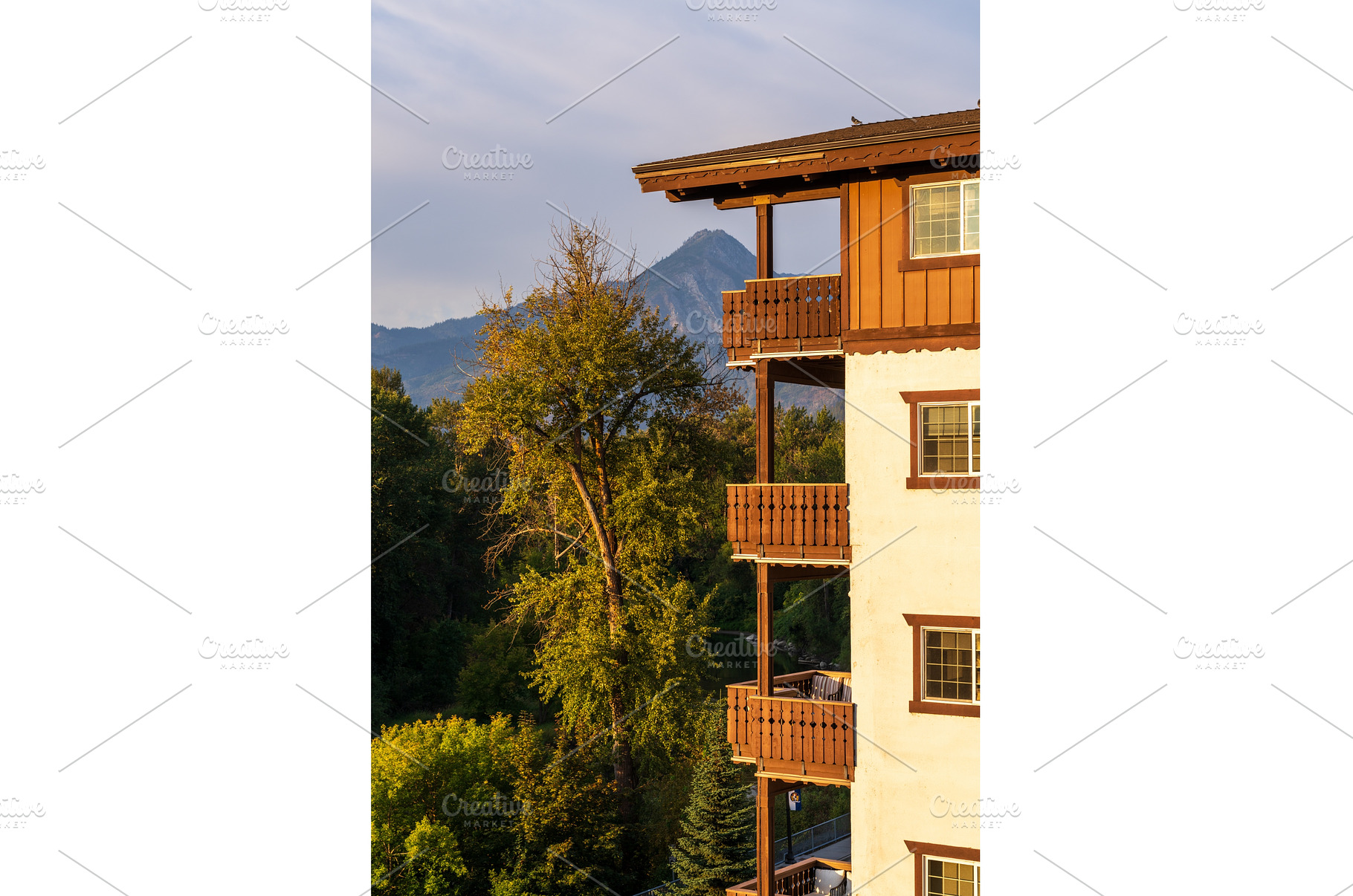 Wooden balconies on Alpine styled, an Architecture Photo by Backyard Stock
