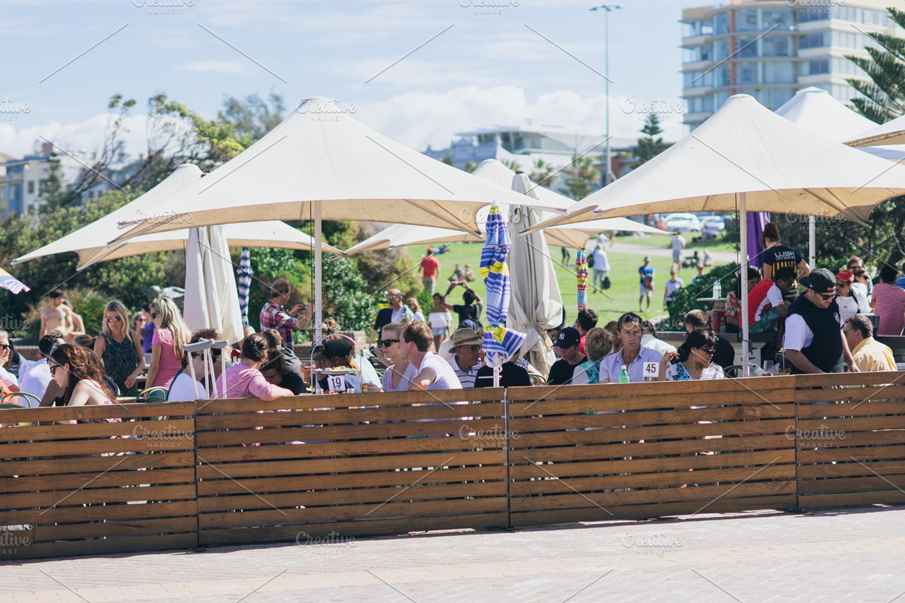 People having lunch beach bar, a Holiday Photo by HBStocks