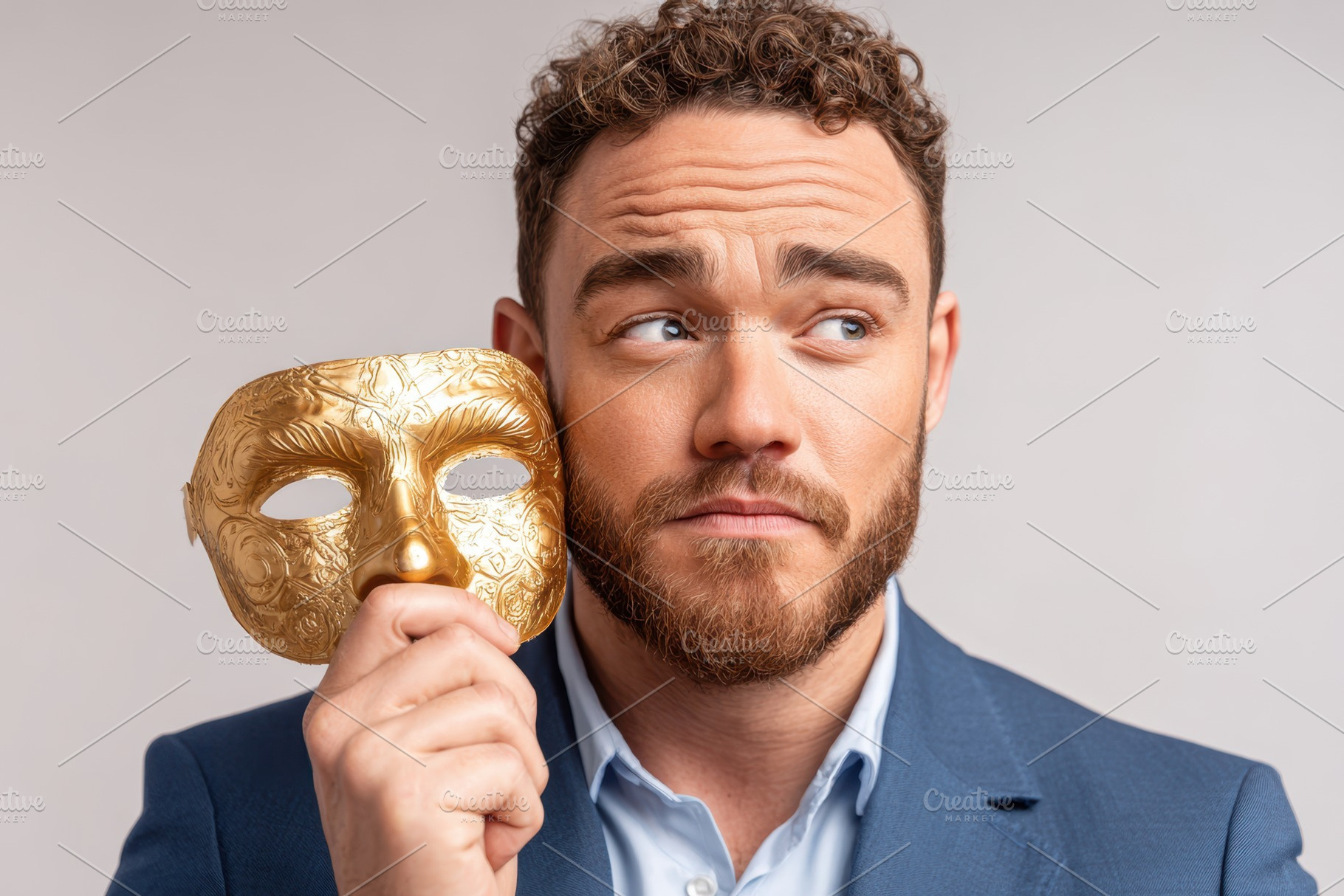 Man holding theatrical mask in contemplation, a Person Photo by AlyaAnd