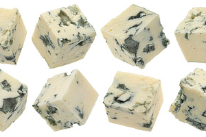 Blue cheese cubes isolated on white, a Food & Drink Photo by Max Lashcheuski