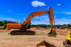 Excavator at construction site, an Industrial Photo by Ungvar Studio