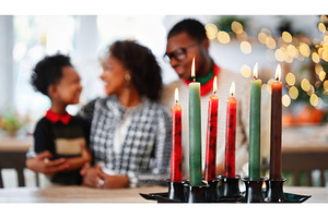 Family gathering around a festive, a Holiday Photo by Igor Tichonow