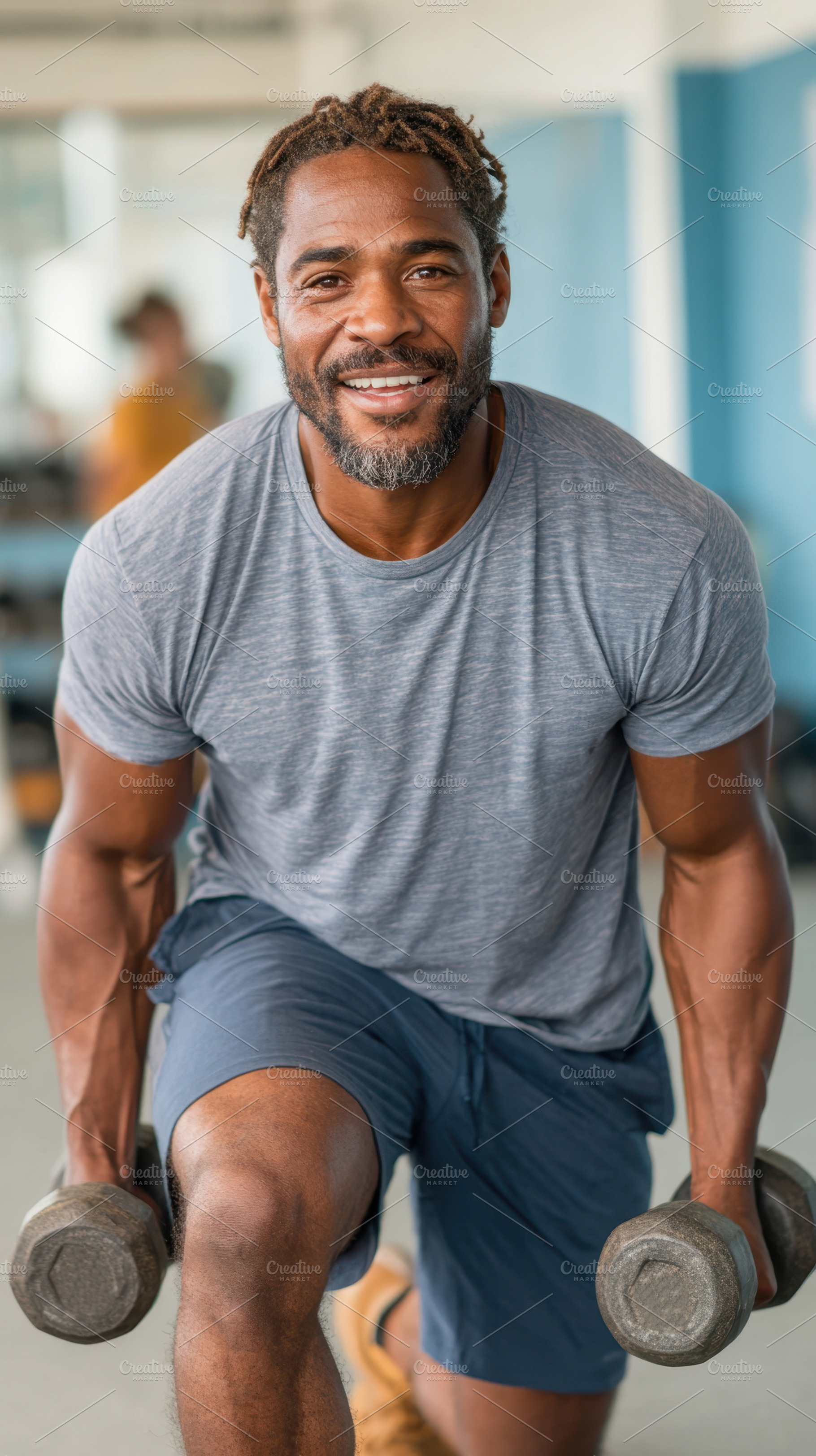 Man exercising with dumbbells in gym, a Sports & Recreation Photo by AlyaAnd