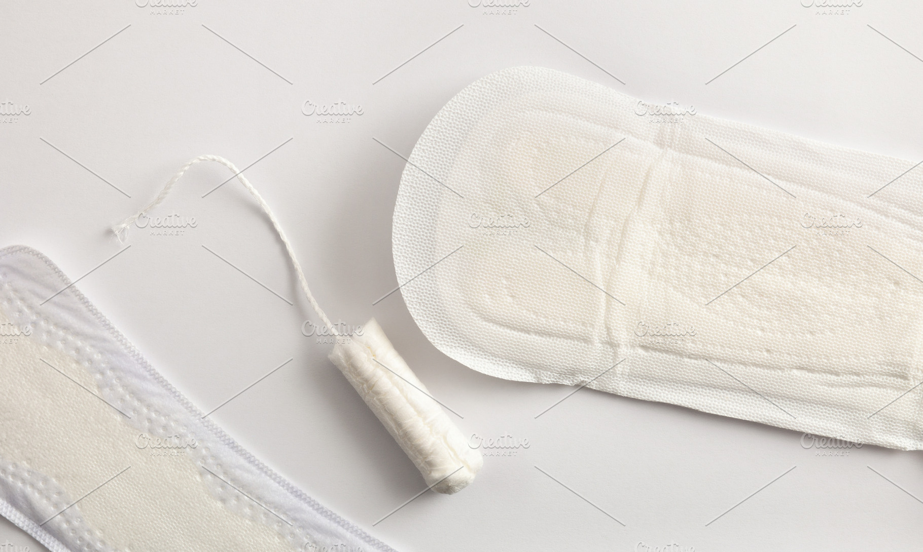 Background with female absorbent protectors for menstrual cycle, a Health & Medical Photo by Davizro's Market