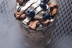 Chocolate Milkshake with Whipped Cream and Chocolate in Glass on, a Photo by MDBildes