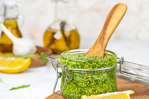 Homemade basil and arugula pesto stock photo containing appetizer and arugula