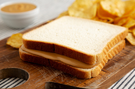 Homemade American Peanut Butter Sandwich on a Wooden Board, side