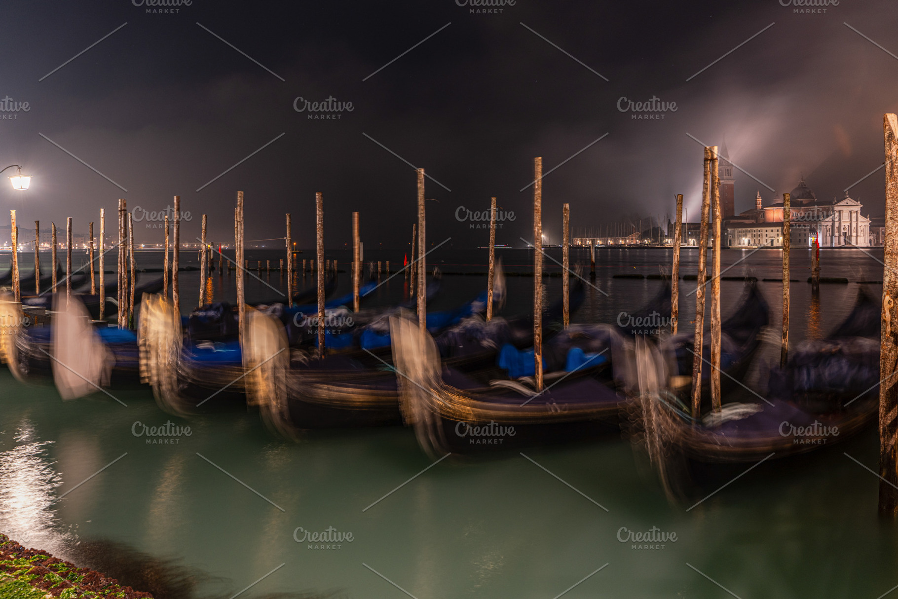 Gondolas along the pavementa and pier of San Marco in Venice, an Architecture Photo by Anna Bogush