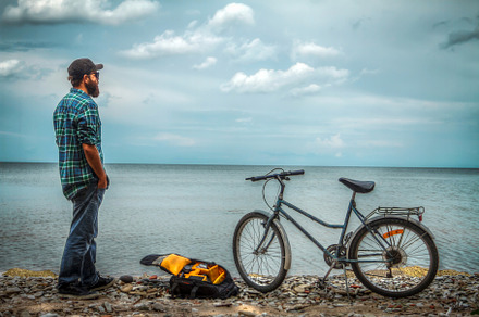 man on a bicycle near the sea., a Photo by Pictures for you!!!!!!!!!