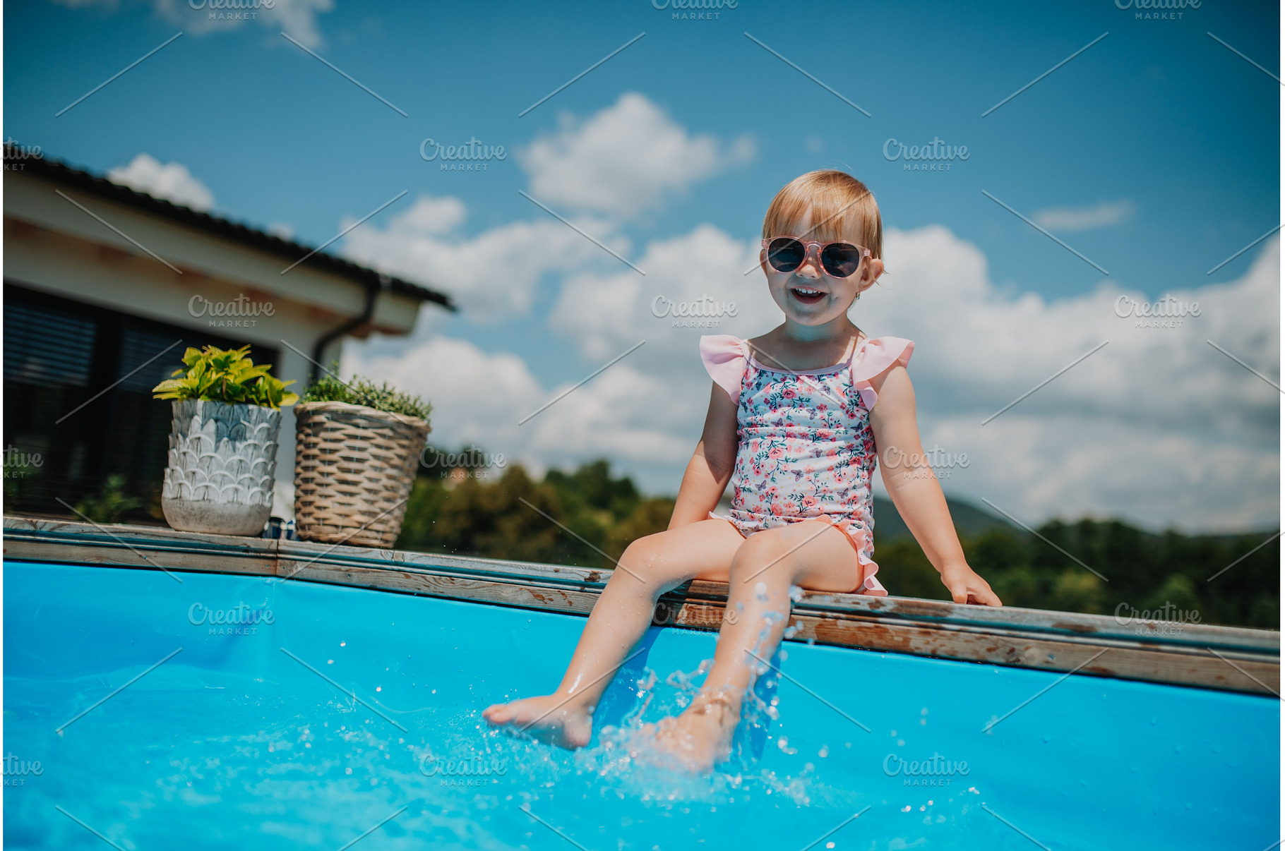 Little girl enjoying summer by the, a Person Photo by HalfPoint