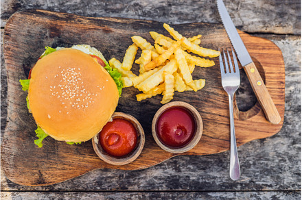 Closeup of fresh burger with French, a Food & Drink Photo by Elizaveta Galitskaya